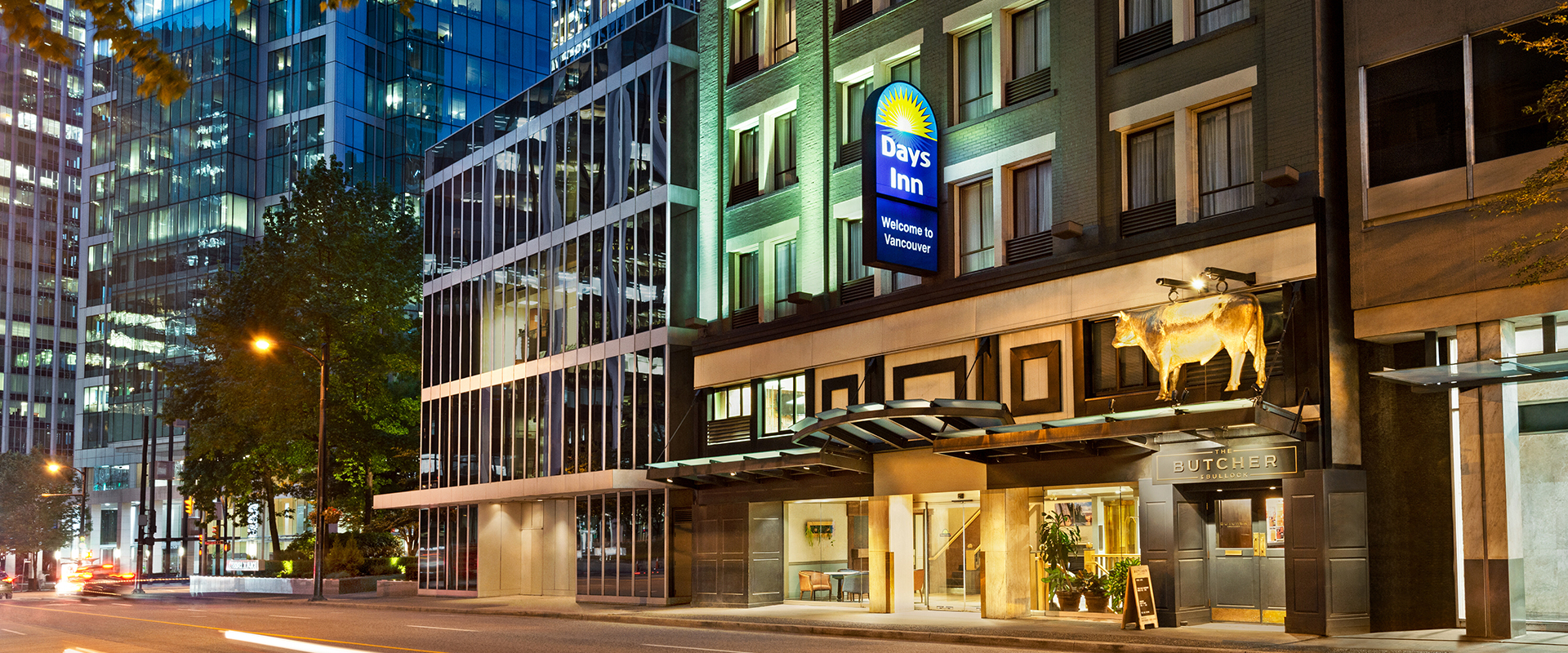 Some amenities found in a suite at Days Inn Vancouver Downtown include coffee maker, mini refrigerator, flatscreen TV and writing desk and chair.